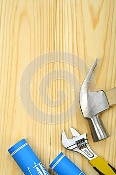 Copyspace image of hammer spanner and blueprints