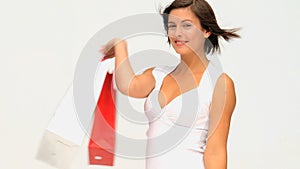 Coquette brownhaired lady holding her shopping bags