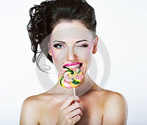 Coquette. Funny Quaint Brunette with Colorful Lollipop