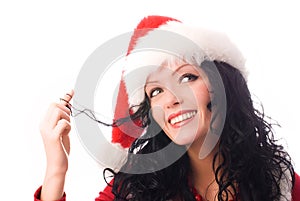 Coquettish brunette woman dressed as Santa photo