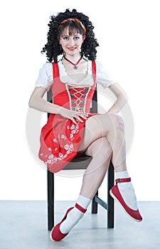 Coquettish woman sitting on chair photo