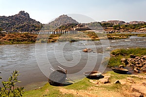 Coracle boats in Tungabhadra River, Hampi ruins, India