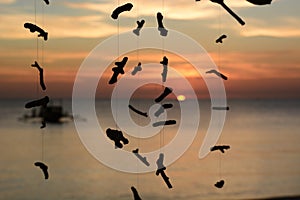 Coral pieces silhouettes at sunset. White beach, station three. Boracay Island. Aklan. Western Visayas. Philippines