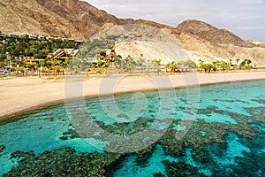 Coral reef of Red Sea, beach and desert near Eilat, Israel