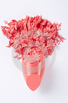 Coral smudged lipstick on white, clipping path