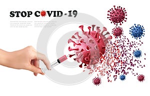 Coranavirus concept background. Hand holding syringe with vaccine destroying virus COVID - 19 photo