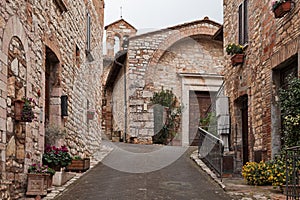 Corciano, Perugia, Umbria, Italy: narrow alley and the ancient Church of San Cristoforo photo