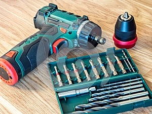 Cordless drill driver with screw bits and drill bits