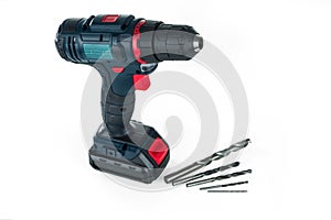 Cordless drill and a set of different drills.