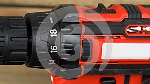 Cordless hand drill driver with auger bit, close-up