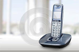 Cordless phone with cradle on white background