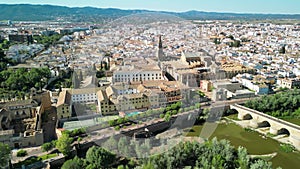 Cordoba, Andalusia. Aerial view of city medieval buildings and bridge on a sunny spring day