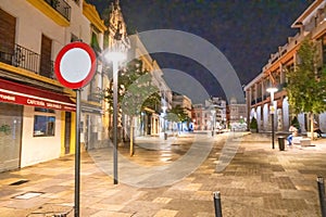 Cordoba, Spain - April 11, 2023: Tourists along the city streets at night