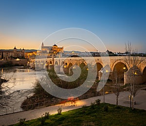 Sunset over Cordoba wit the Puente Romano photo