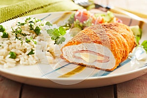 Cordon bleu chicken with rice and parsley