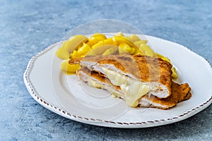 Cordon Bleu Chicken Schnitzel with Potato Salad. Half cut