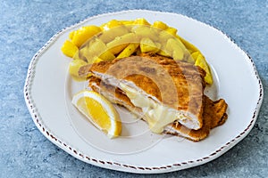 Cordon Bleu Chicken Schnitzel with Potato Salad. Half cut