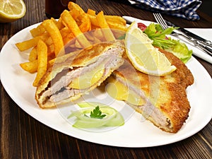 Cordon Bleu with French Fries - Cordon Bleu with French Fries on wooden Background