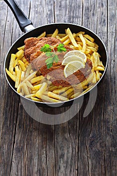 Cordon Bleu and french fries in skillet