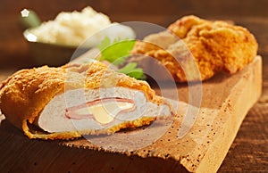 Cordon bleu pork on wooden board