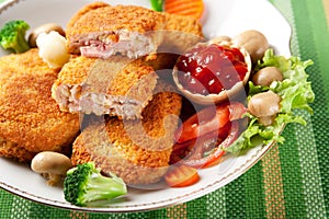 Cordon bleu with vegetables garnish photo