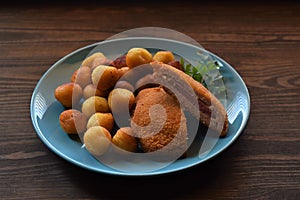 Cordon blue with garnish potato balls on the plate