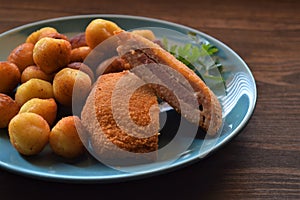 Cordon blue with garnish potato balls on the plate