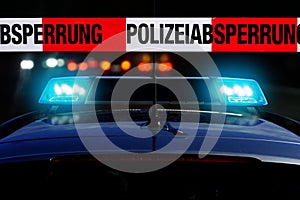 Cordon tape with the word â€žPolizeiabsperrungâ€œ, the german word for police cordon