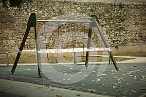 Cordoned off A-frame swing in a kids playground