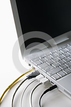 Cords Plugged Into Laptop Computer