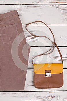 Corduroy pants and leather bag