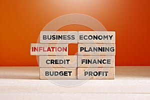 Core business financial inscriptions on wooden blocks with the word inflation taken out. Inflation and economic crisis