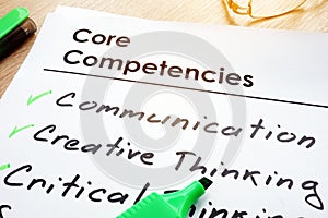 Core Competencies list on a table.