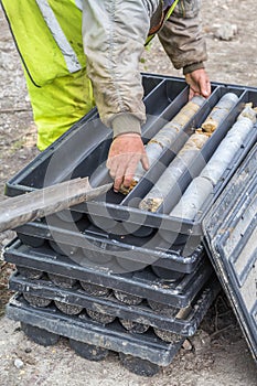 Core drill worker extracts core samples