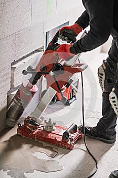 Core Drilling into Concrete Wall During Construction Work