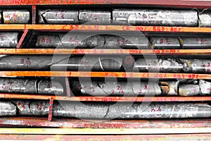 Core samples stored in a box. Geological