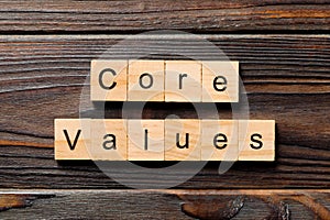 CORE VALUE word written on wood block. CORE VALUES text on wooden table for your desing, concept