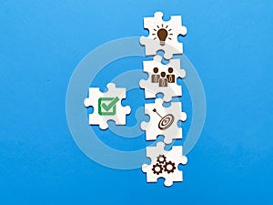 Core Values and leadership qualities icons on jigsaw puzzle pieces.