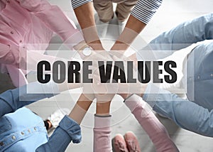 Core values. People holding hands together, top view