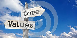 Core values - wooden signpost with two arrows