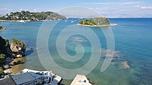 corflu pontikonisi small island boats ariplanes swimming girl greece photo