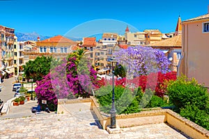 CORFU ISLAND, GREECE, JUN,06, 2014: Downtown garden park colorful trees flowers Greek old houses architecture of Greece Corfu isla