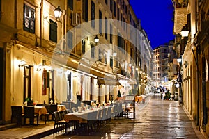 Corfu old town city streets at night with restaurants photo