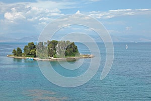 Corfu`s coastline and Mouse Pontikonisi Island, Garitsa Bay, Corfu Island, Greece, Europe