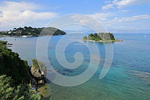 Corfu`s coastline and Mouse Pontikonisi Island, Garitsa Bay, Corfu Island, Greece, Europe