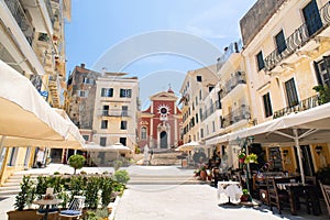 Corfu town beautiful street with cafe and flowers, Corfu island, Ionian islands, Greece.