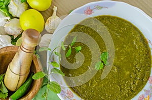 Coriander ( cilantro) and mint chutney in a bowl