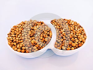 Coriander seeds, Chinese parsley seed spice herb food ingredient in bowl cilantroseeds dhaniabeej dhaniye ke beej photo