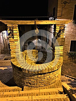 Corinaldo town in the province of Ancona, Marche region, Italy. History, time, stairway and water well photo