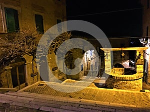 Corinaldo town in the province of Ancona, Marche region, Italy. History, time, stairway and water well photo